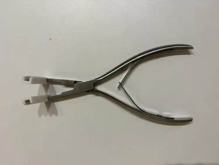 Tape-in hajhoz fogó